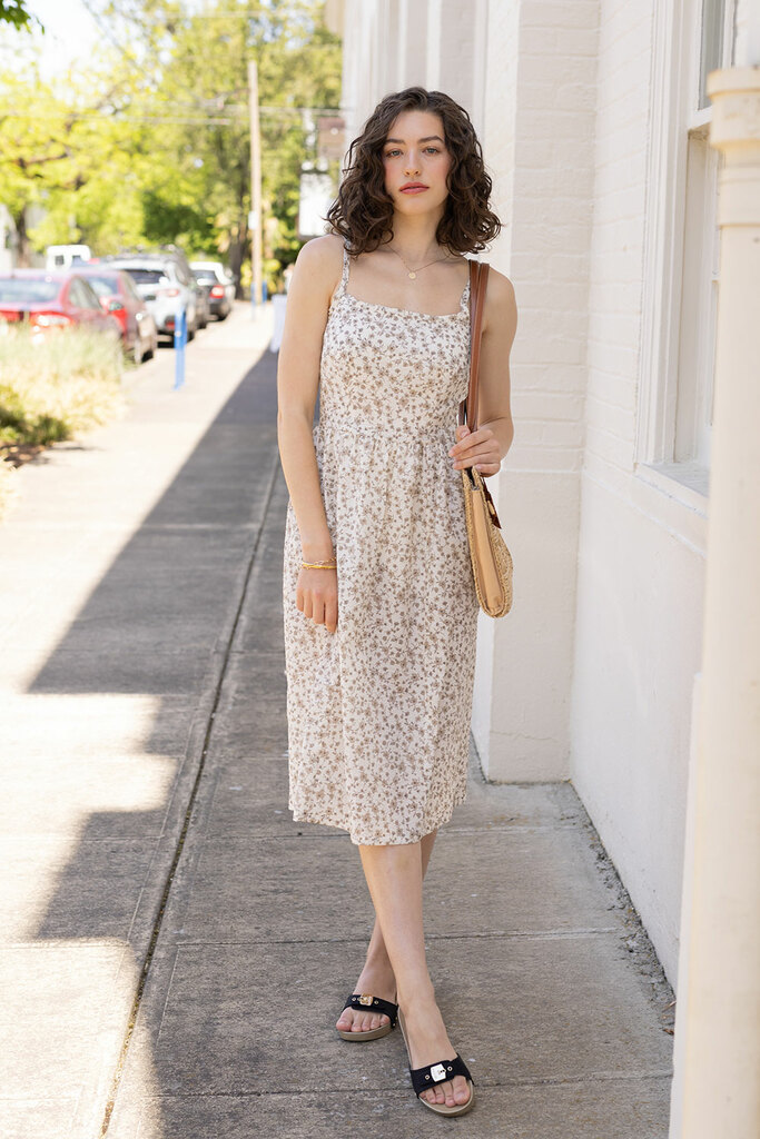 woman modeling in floral Mora dress