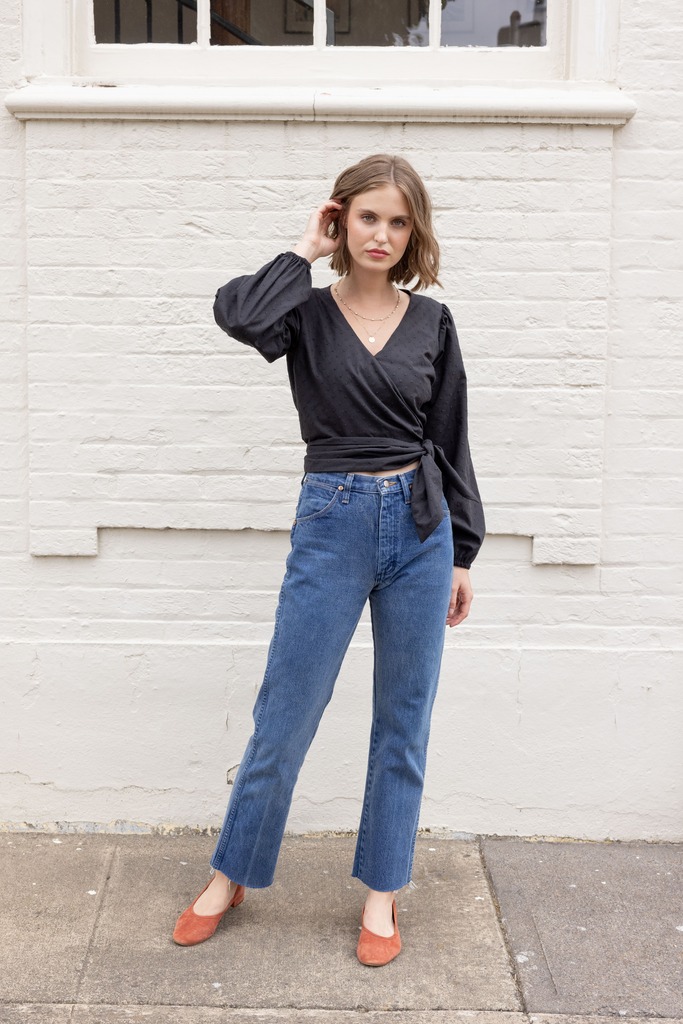 Woman modeling black Idra top