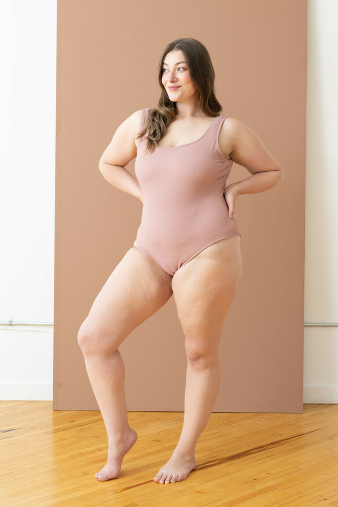 woman modeling pink Reese swimsuit