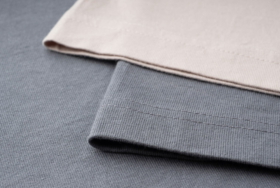 [image-02: Close-up of cotton lawn fabric showing its fine, smooth texture, with a folded edge to demonstrate drape and a completed Sage blouse made in Liberty tana lawn]