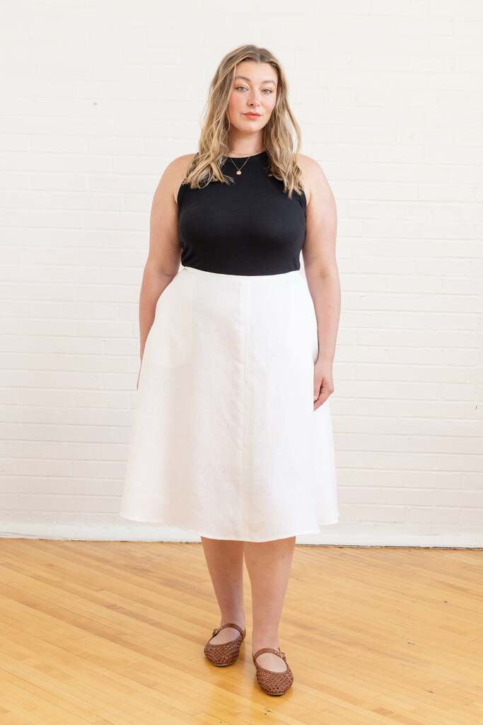 Woman wearing white Arbor skirt