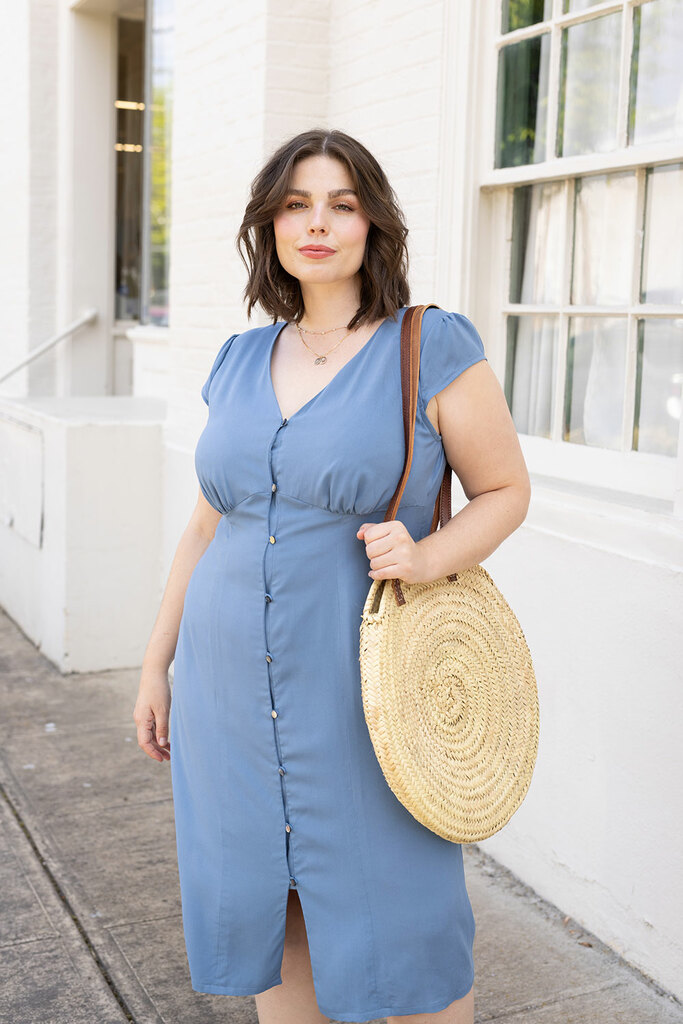 woman walking in blue lilac dress