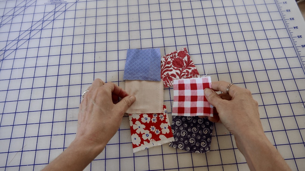 collection of fabric swatches laid out on a desk