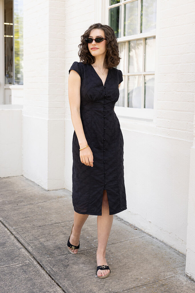 woman walking in black lilac dress