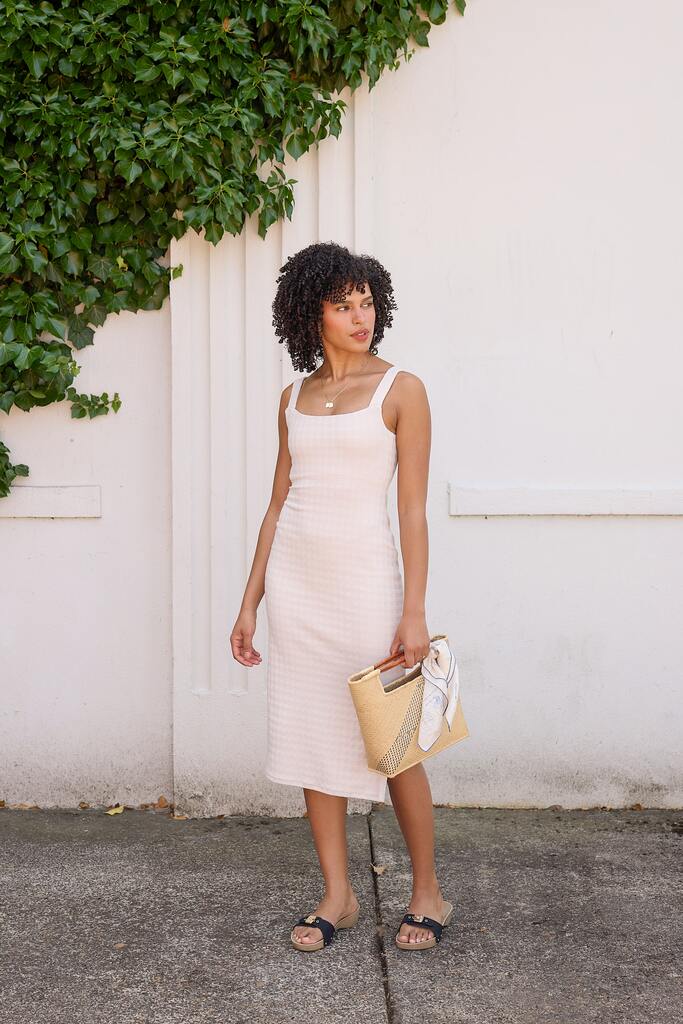 woman modeling black and white citron dress