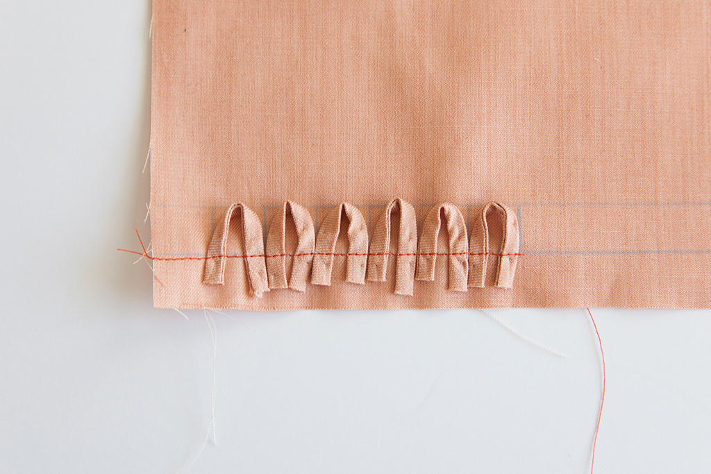 stitched button loops