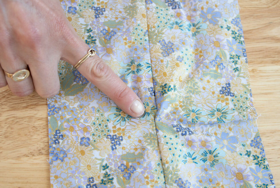 [image-06: close-up of the transition point between zipper and regular seam, showing both problematic and properly executed transitions]