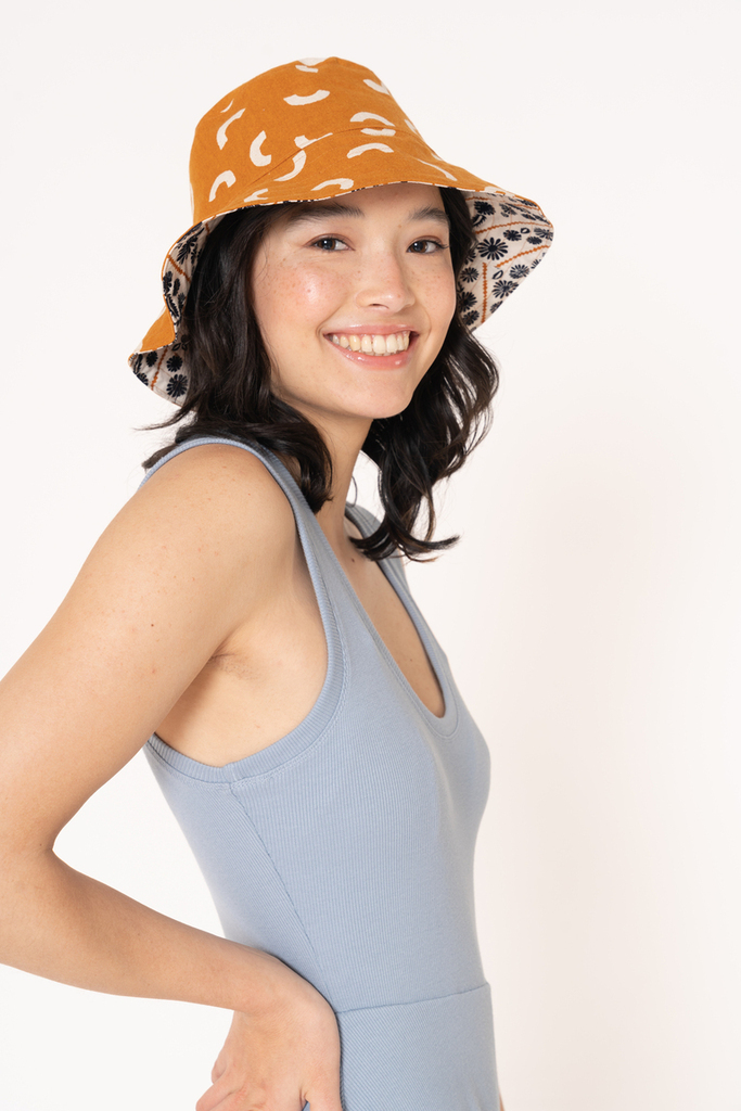 woman modeling Rey bucket hat