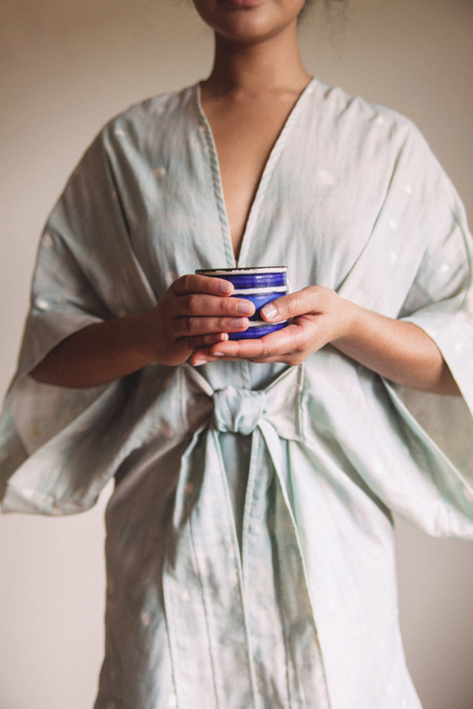 Woman wearing Almada robe front