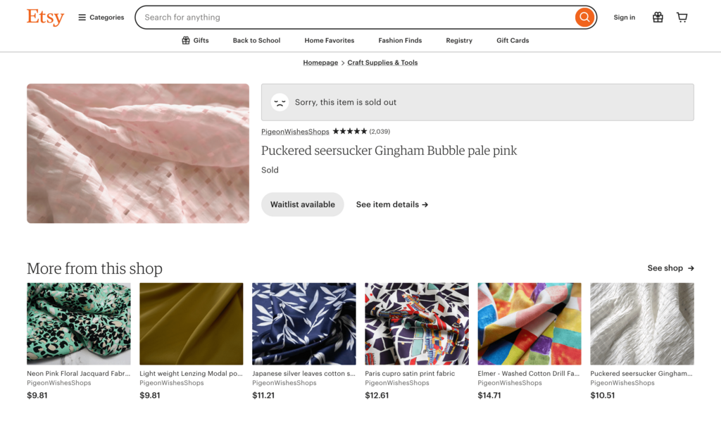 phone screen showing a bookmarked fabric website with sold out items
